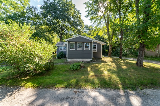 view of outdoor structure with a lawn