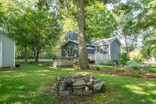 view of yard featuring a hot tub and a deck