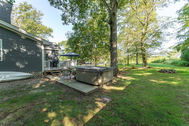 view of yard featuring a patio area and a deck