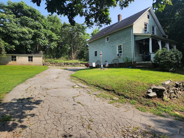 view of home's exterior featuring a yard