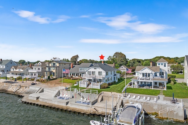 back of property with a water view