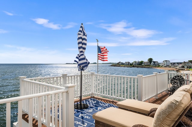 wooden terrace with a water view