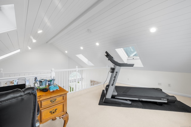 workout room with carpet floors, lofted ceiling with skylight, and wood ceiling