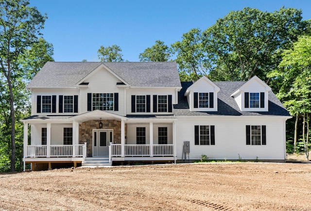 289 Young St, East Hampton, CT 06424 - colonial home with stone siding, roof with shingles, and covered porch