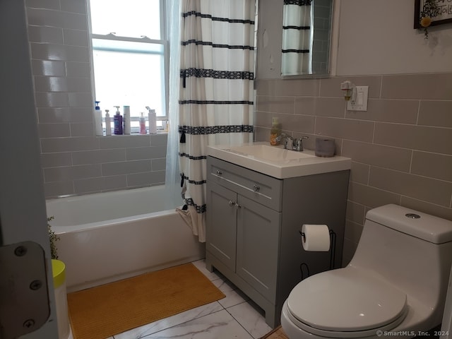 full bathroom with vanity, toilet, tile walls, and shower / bathtub combination with curtain