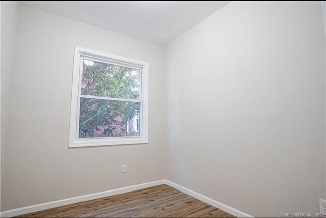 empty room featuring wood-type flooring