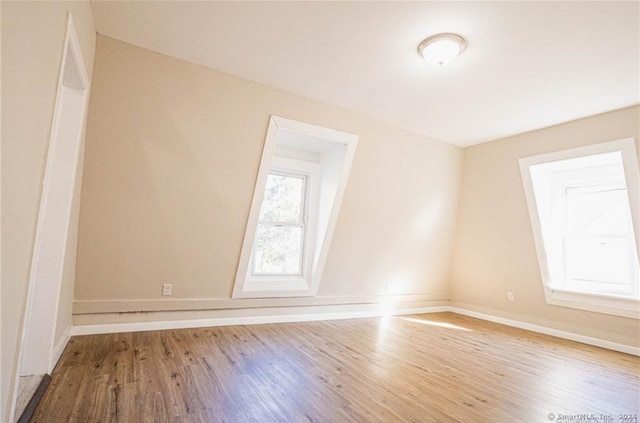 spare room featuring hardwood / wood-style flooring