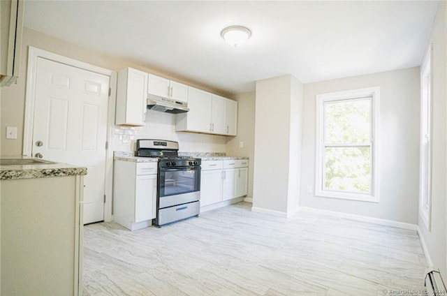 kitchen with stainless steel range with gas stovetop, decorative backsplash, a baseboard heating unit, and white cabinets