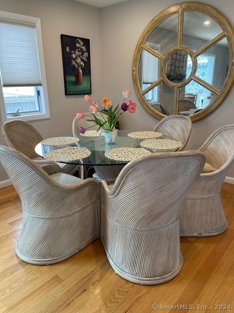 dining room featuring baseboards and wood finished floors