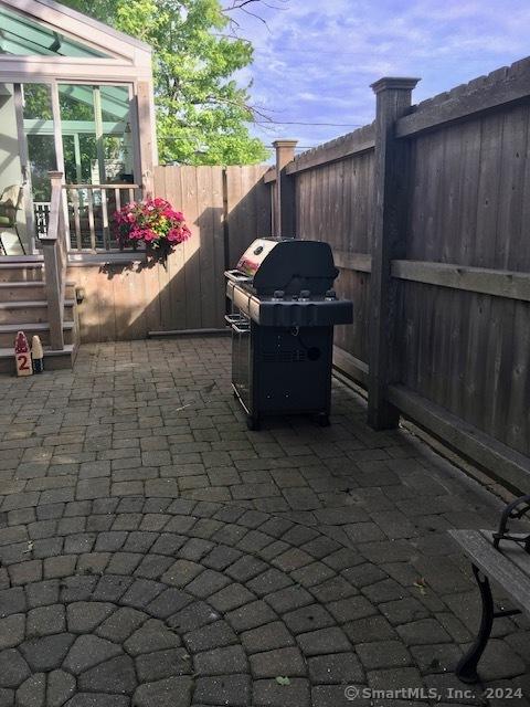 view of patio / terrace featuring a fenced backyard and area for grilling