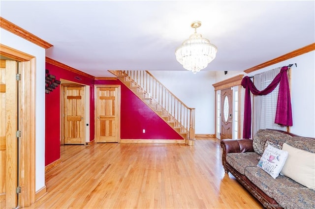 unfurnished living room with an inviting chandelier, crown molding, and wood-type flooring