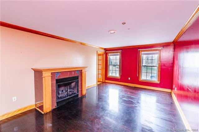 unfurnished living room featuring hardwood / wood-style floors and crown molding