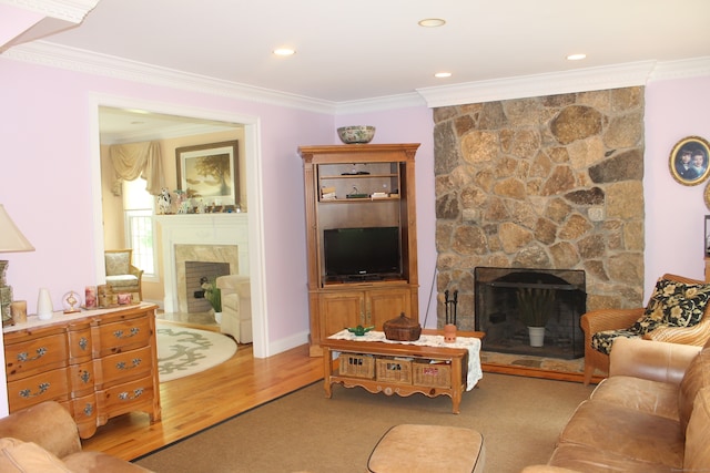 living room with crown molding, light carpet, and a fireplace