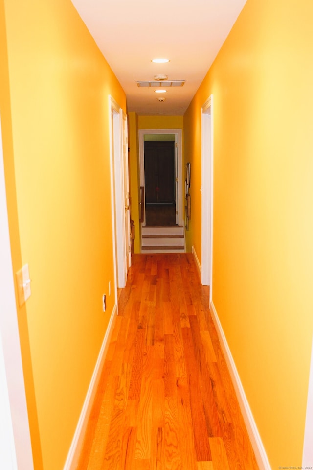 hall with wood-type flooring