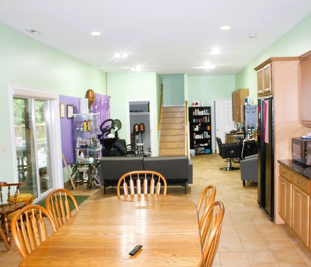 dining area featuring light tile patterned floors