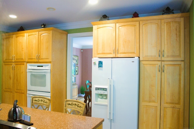 kitchen with light brown cabinetry, crown molding, and white appliances