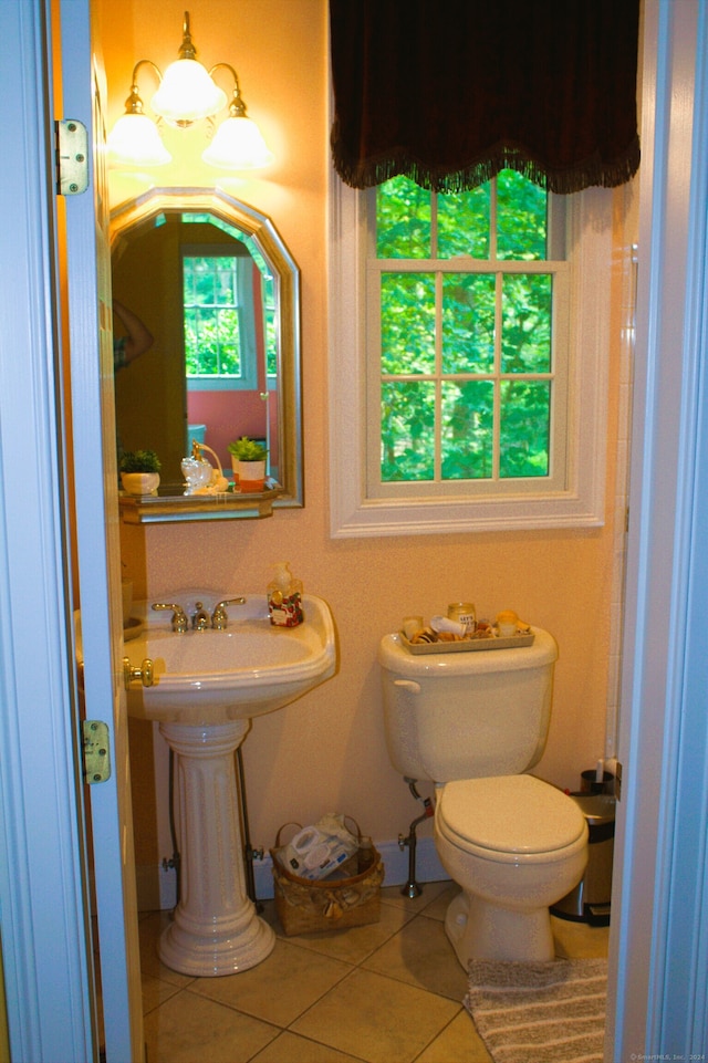 bathroom with tile patterned floors and toilet