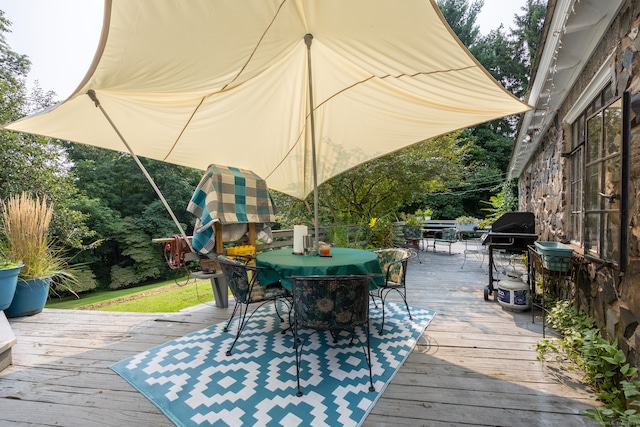 wooden terrace featuring area for grilling