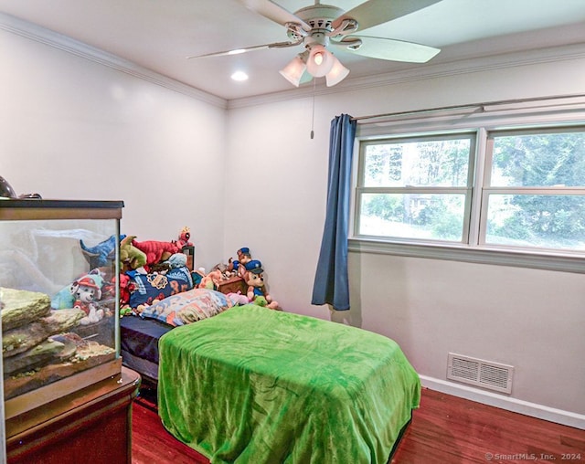 bedroom featuring ornamental molding, ceiling fan, and dark hardwood / wood-style floors