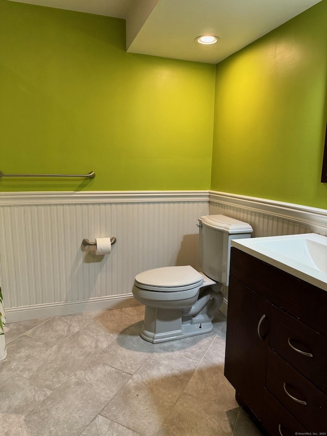 bathroom featuring toilet and vanity