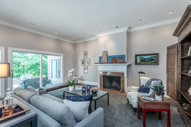 carpeted living room featuring ornamental molding and a fireplace