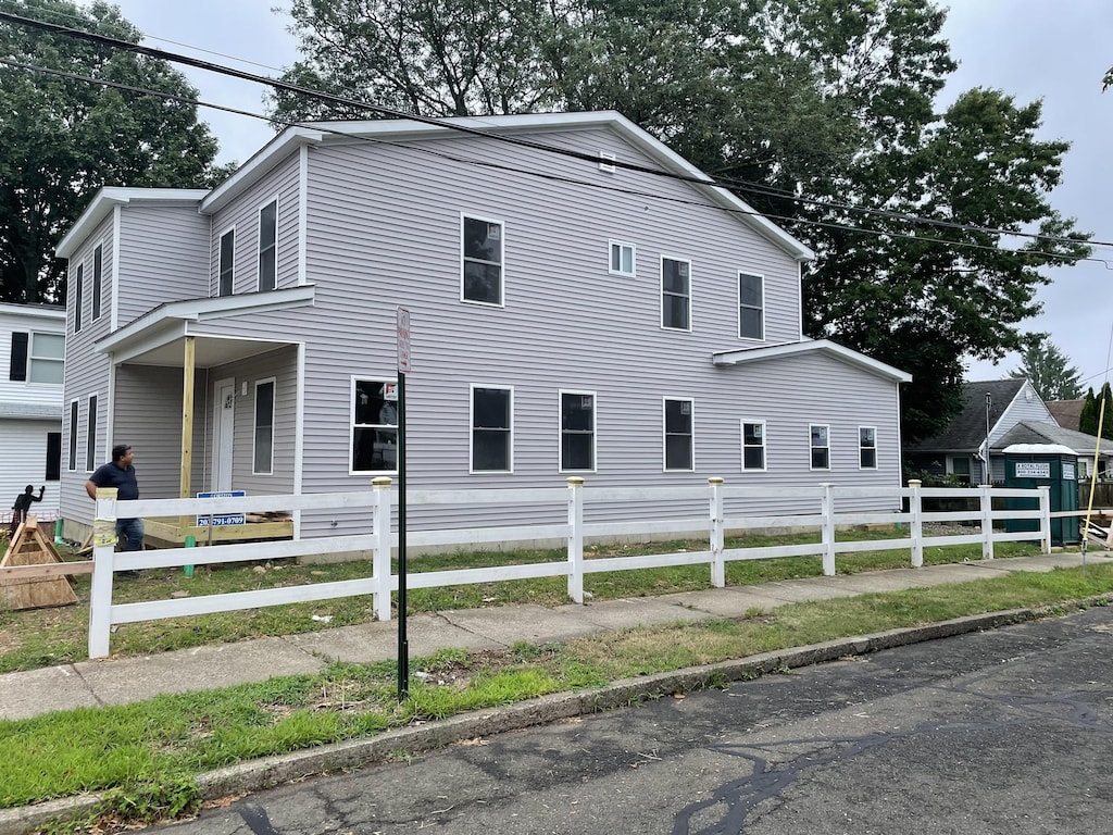 view of home's exterior featuring fence