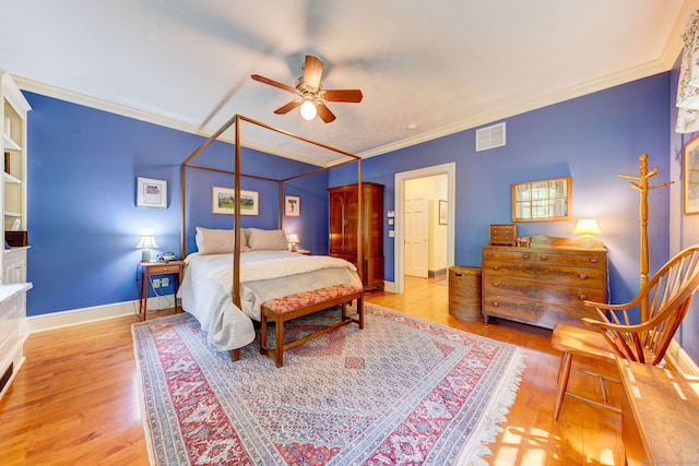 bedroom featuring ornamental molding and light wood-type flooring