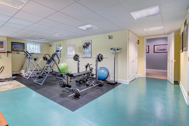 exercise area featuring a drop ceiling