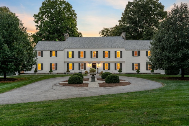 view of front of house with a yard