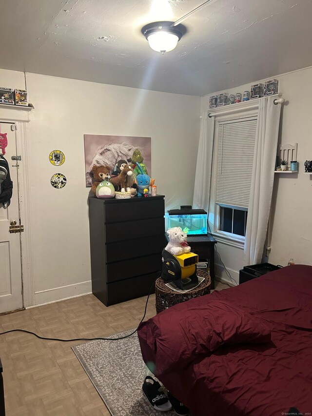 bedroom featuring light parquet floors