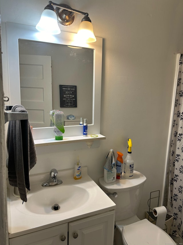 bathroom with vanity and toilet