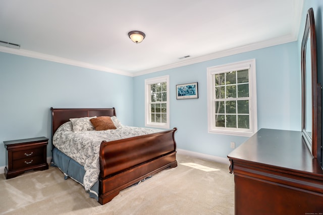 bedroom with light carpet and crown molding