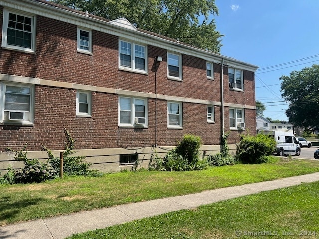 view of property exterior with a yard