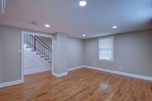 empty room with light hardwood / wood-style flooring