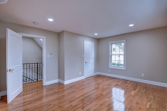 spare room with light hardwood / wood-style flooring