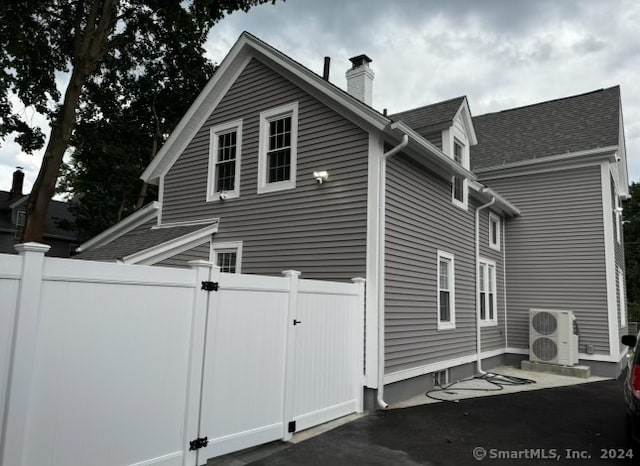 view of home's exterior with central AC unit