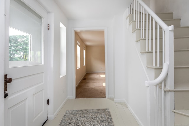 foyer featuring carpet