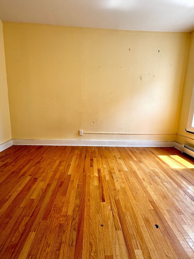 spare room featuring light hardwood / wood-style floors