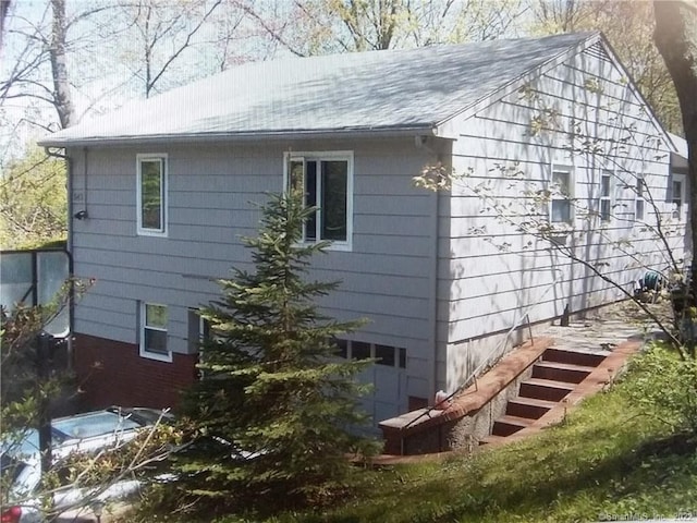 view of home's exterior featuring stairs