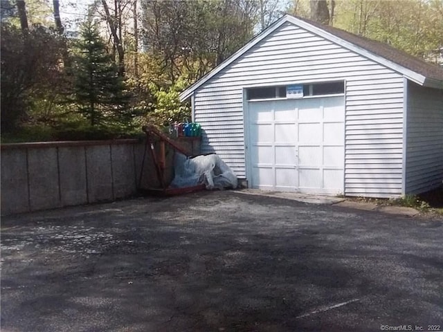detached garage featuring driveway