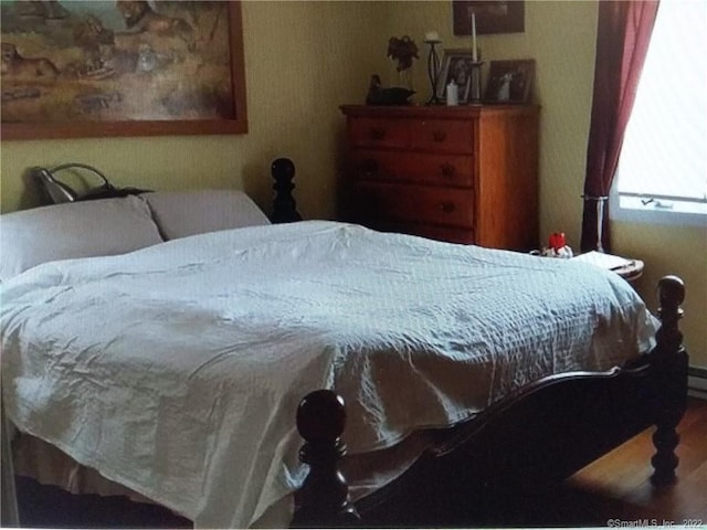 bedroom with wood finished floors
