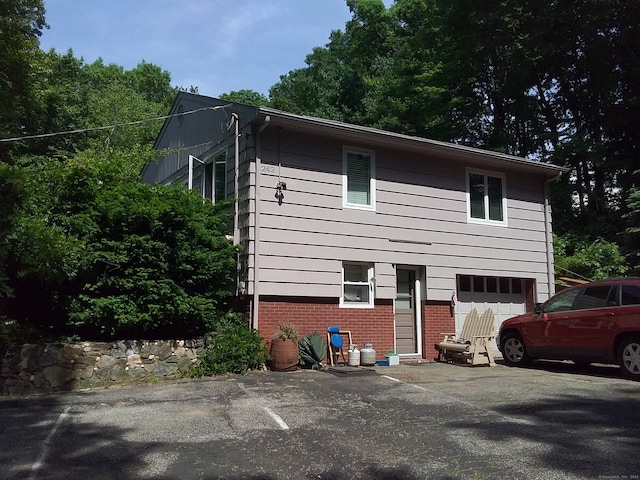 view of side of property featuring a garage