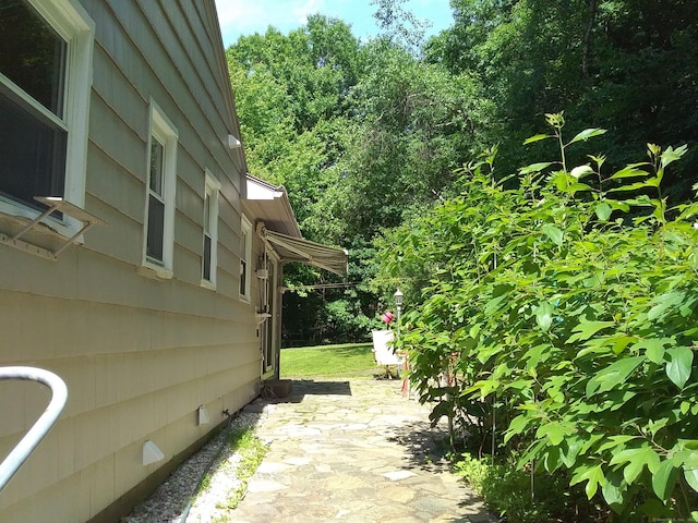 view of side of home featuring a patio