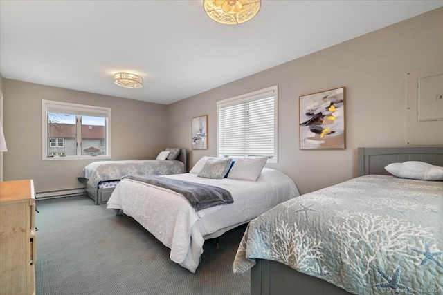 bedroom with a baseboard heating unit and carpet floors