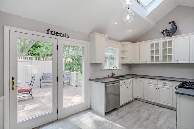 kitchen with white cabinets and plenty of natural light