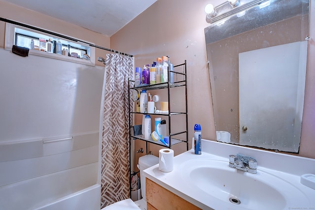 full bathroom with shower / tub combo, toilet, and vanity