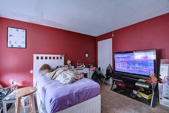 carpeted bedroom with a textured ceiling