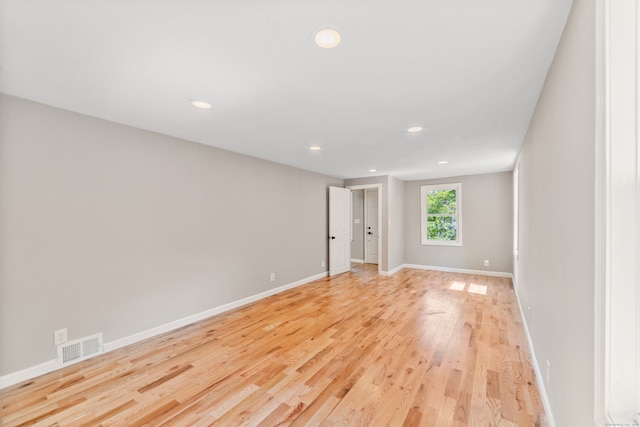 spare room with light hardwood / wood-style floors