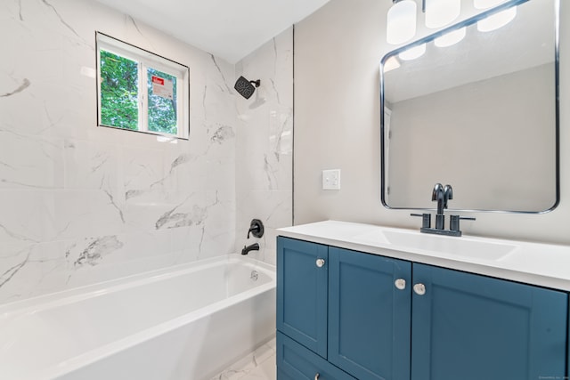 bathroom with vanity and tiled shower / bath