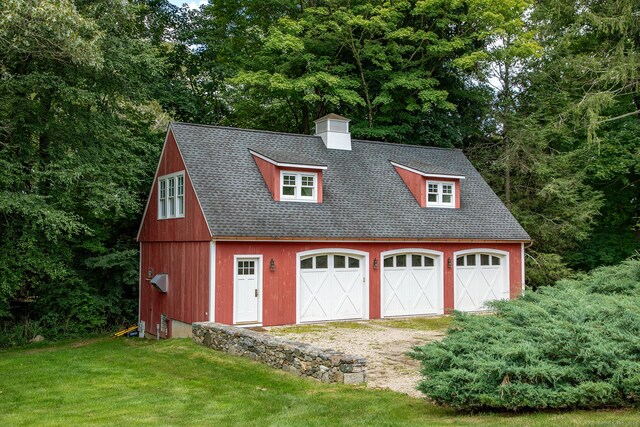 garage with a yard